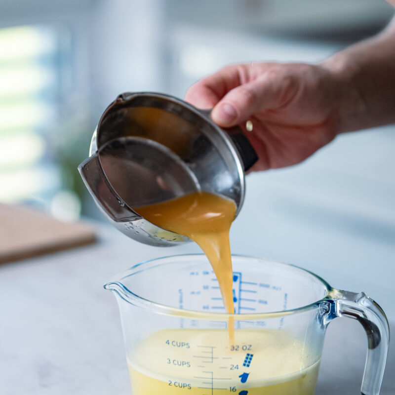 Fresh orange juice being added into the Super Juice base